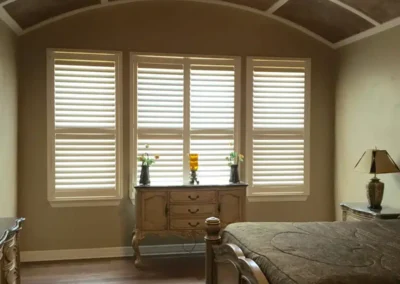 plantation shutters arched ceiling bedroom