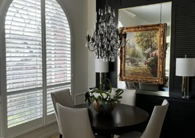 plantation shutters arched window elegant dining